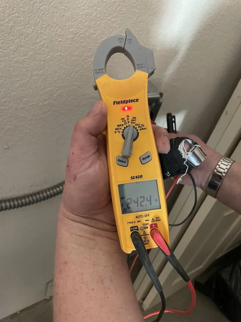 Voltage testing with clamp meter during Outlet Installation in Corning